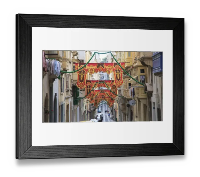 Framed Print : Flags decorate historic street in city centre of Valletta