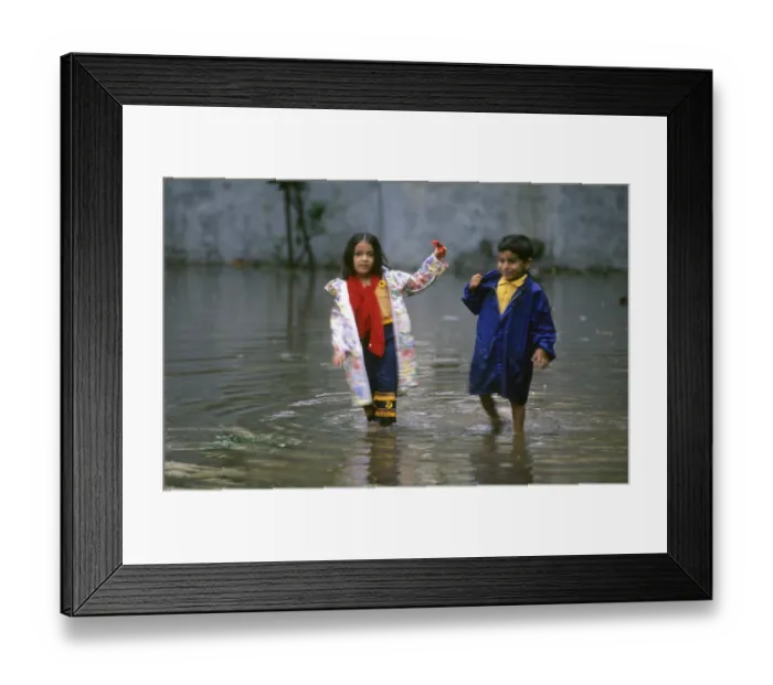 Framed Print : Children playing in Rain Water Framed Print : Children playing in Rain Water