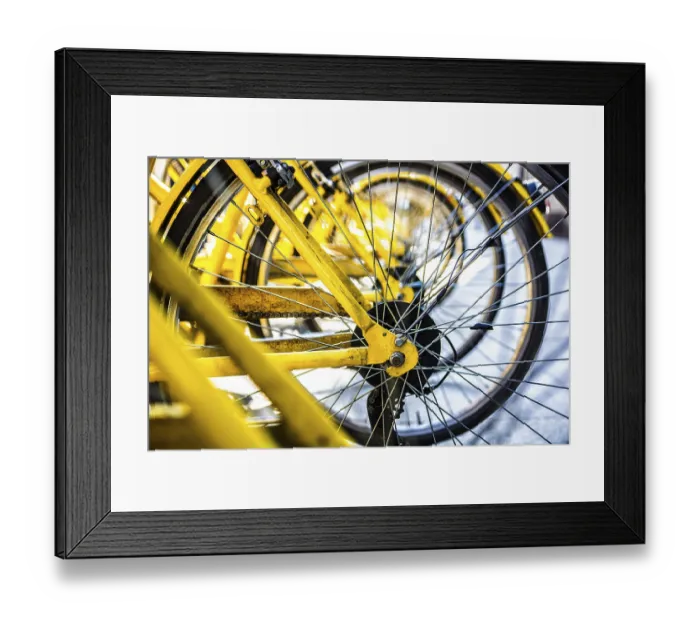 Framed Print : Yellow bike',s wheel in row outdoor. Close-up Framed Print : Yellow bike',s wheel in row outdoor. Close-up