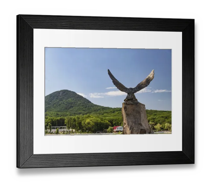Framed Print : Bronze statue of the eagle-the symbol of the Caucasus on the background of mountains Framed Print : Bronze statue of the eagle-the symbol of the Caucasus on the background of mountains