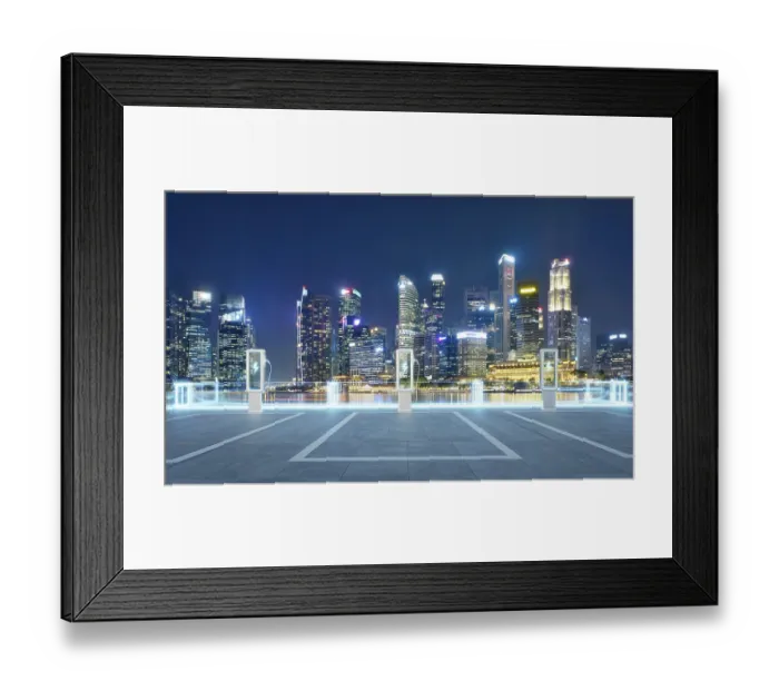 Framed Print : Empty parking lot with ev chargers glowing against the backdrop of singapore's illuminated skyline at night Framed Print : Empty parking lot with ev chargers glowing against the backdrop of singapore's illuminated skyline at night