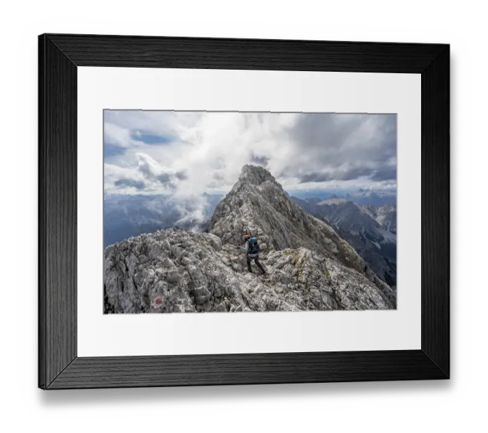 Framed Print : Mountaineer on a narrow rocky ridge Framed Print : Mountaineer on a narrow rocky ridge