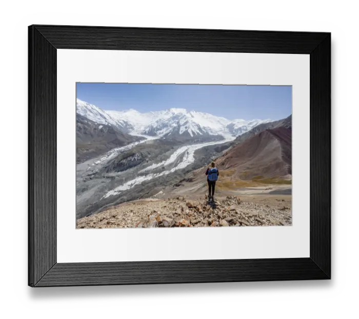 Framed Print : Mountaineer at Traveller's Pass with view of impressive mountain landscape