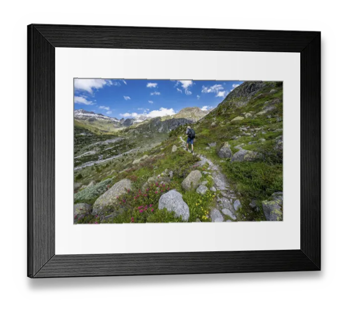 Framed Print : Mountaineers on a hiking trail in front of a picturesque mountain landscape