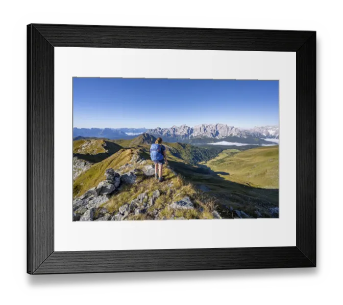 Framed Print : Mountaineer on a grassy ridge, mountain panorama Framed Print : Mountaineer on a grassy ridge, mountain panorama