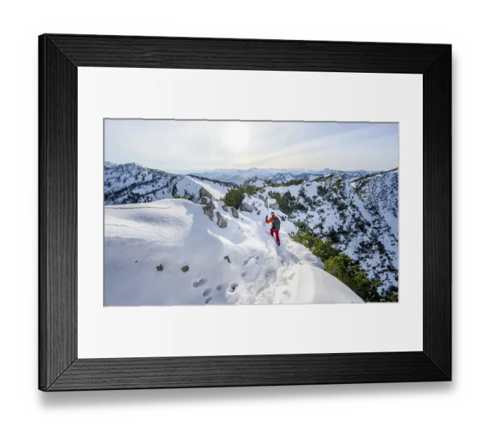 Framed Print : Mountaineer on the ridge of the Aiplspitz in the snow