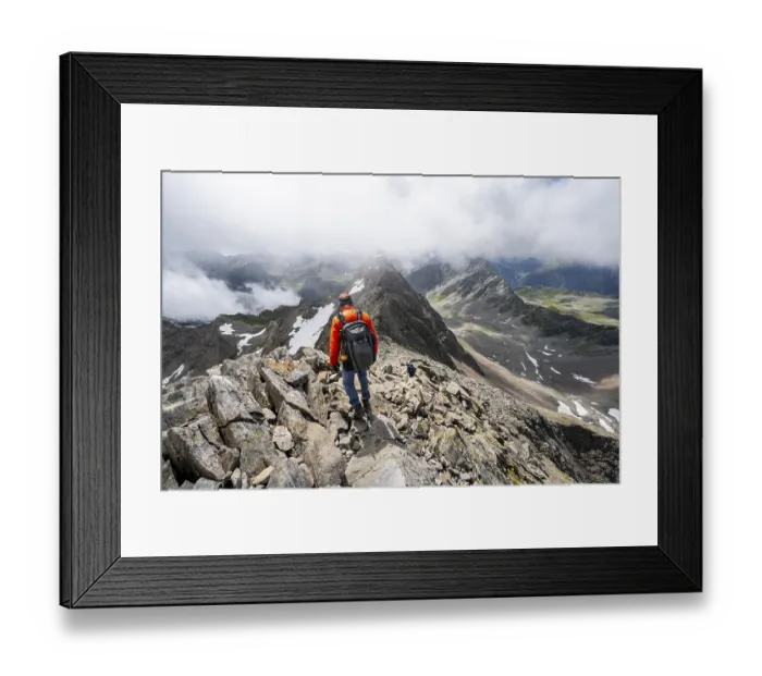 Framed Print : Mountaineer on the summit of Lasoerling Framed Print : Mountaineer on the summit of Lasoerling