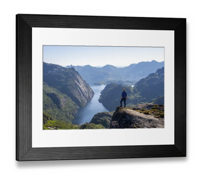 Framed Print : Mountaineer, young man in front of mountain landscape