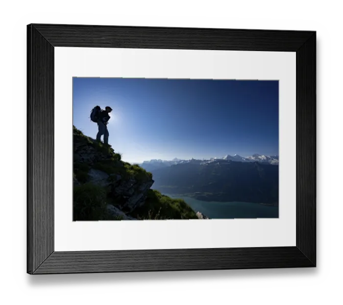 Framed Print : Mountain ridge with mountaineers and Swiss mountains and Lake Thun in the background at sunrise Framed Print : Mountain ridge with mountaineers and Swiss mountains and Lake Thun in the background at sunrise