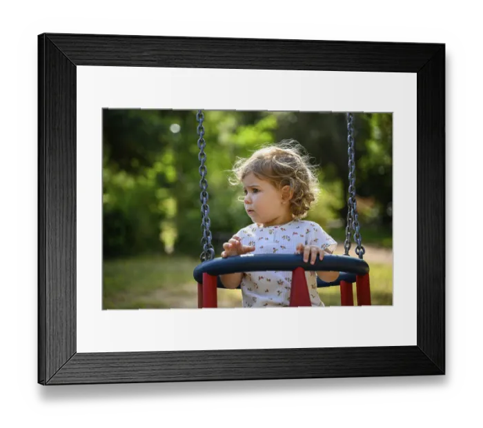 Framed Print : Child, 2 years old, on a swing outdoors