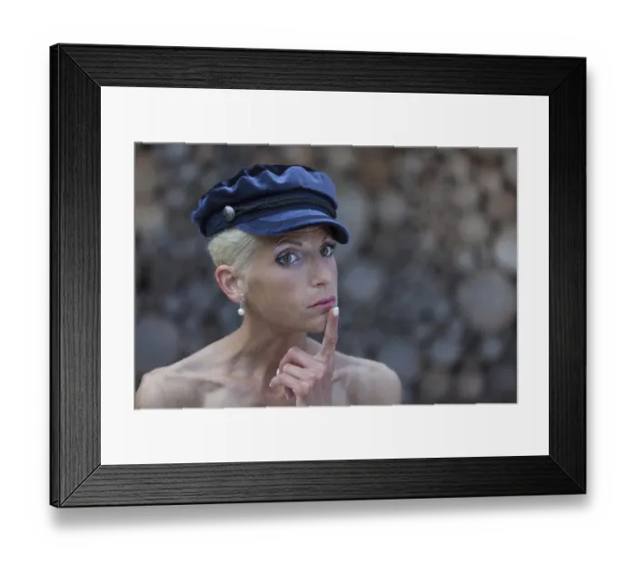 Framed Print : Thoughtful woman with blue cap Framed Print : Thoughtful woman with blue cap