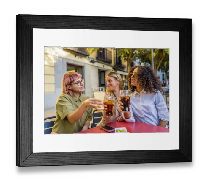Framed Print : Women toasting and celebrating together sitting on an outdoor bar during sunset in the city Framed Print : Women toasting and celebrating together sitting on an outdoor bar during sunset in the city