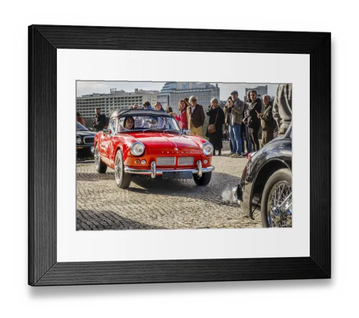 Framed Print : Lisbon, Portugal, Jan 20, 2024: Classic Triumph Spitfire 4 car on a cobblestone road during Classic English Cars parade