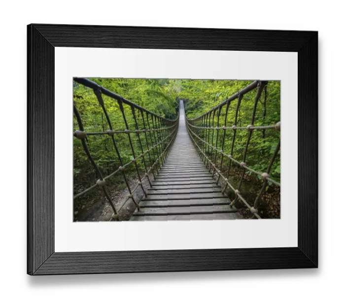 Framed Print : Wooden suspension bridge over a gorge