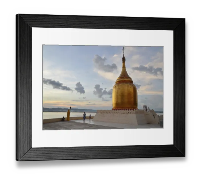 Framed Print : Burmese visitors and pilgrims at the gilded Bupaya Pagoda at the Ayeyarwady river in the evening light