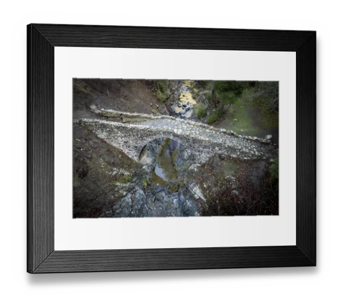 Framed Print : Aerial drone photograph of a medieval stoned bridge with water flowing in the river