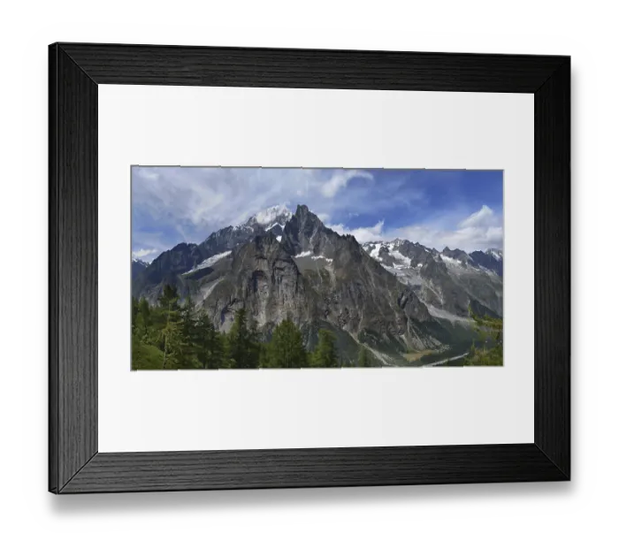 Framed Print : Mountains and pine trees under cloudy blue sky