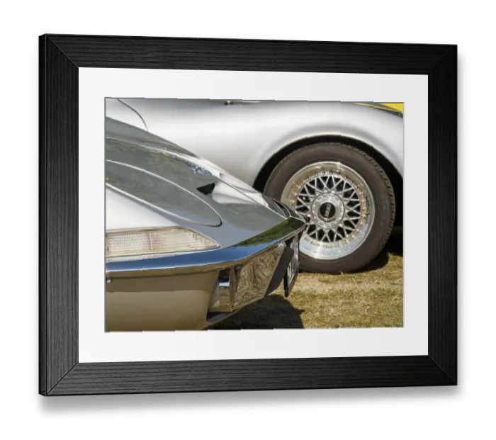 Framed Print : Two classic cars with shiny chrome parts and stylish rims standing side by side