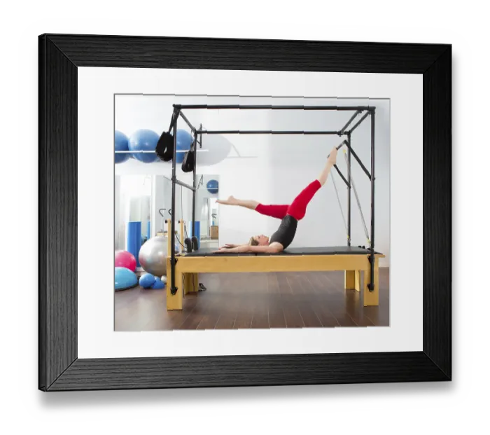 Framed Print : Aerobics pilates instructor woman in cadillac fitness exercise