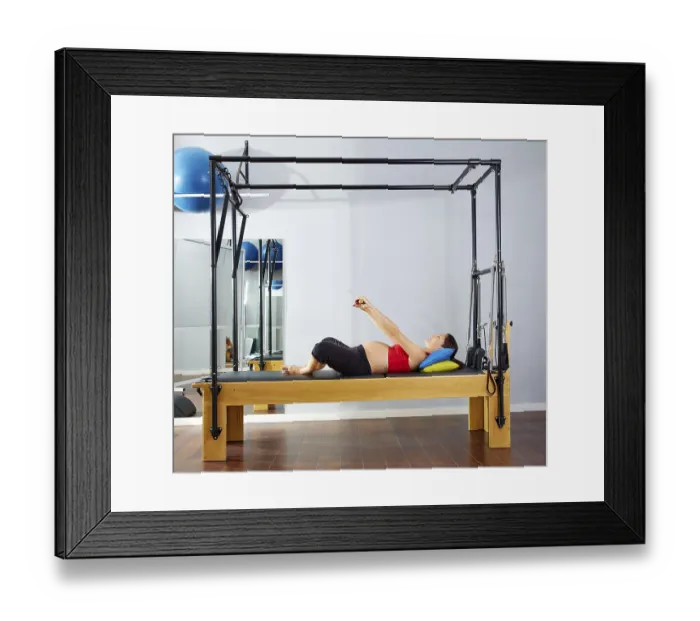 Framed Print : Pregnant woman pilates reformer cadillac exercise workout at gym Framed Print : Pregnant woman pilates reformer cadillac exercise workout at gym