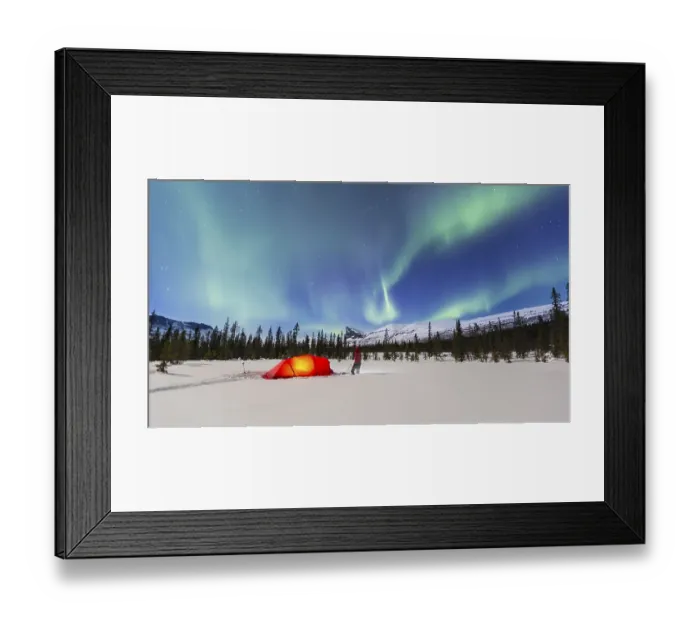 Framed Print : Northern Lights (Aurora borealis) above a red illuminated tent in winter
