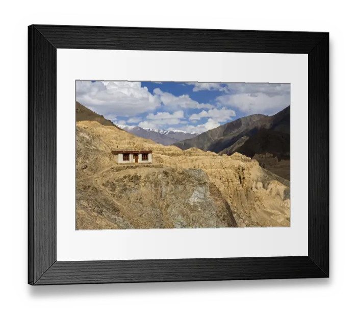Framed Print : One of meditation cell of Lamayuru Buddhist Monastery rising above mass of eroded cliffs on Leh Kargil road