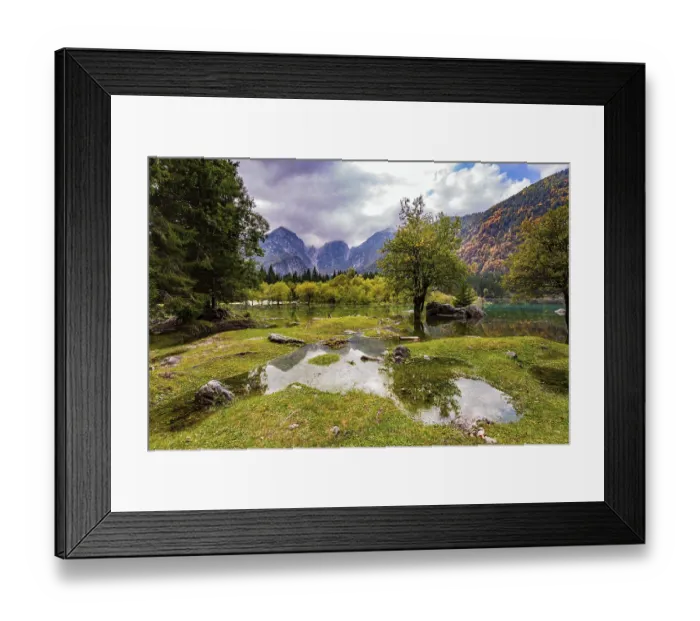 Framed Print : The lake shores are flooded. The mountains are covered with low clouds