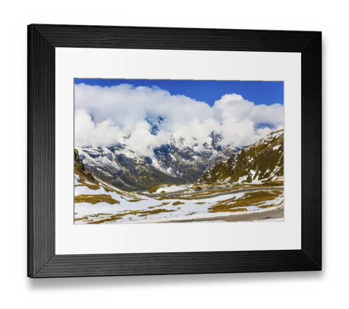 Framed Print : Grand Austrian Alps. The snow on the mountainside began to melt