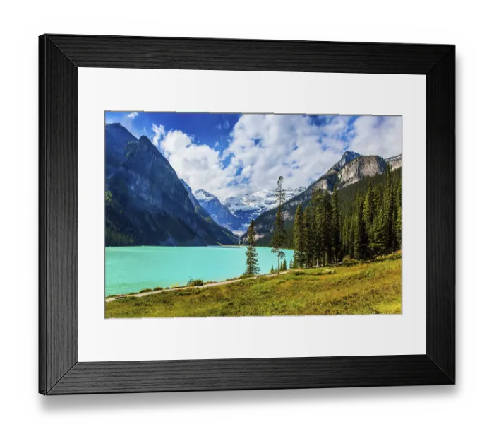 Framed Print : The lake with azure water is surrounded by mountains and forests