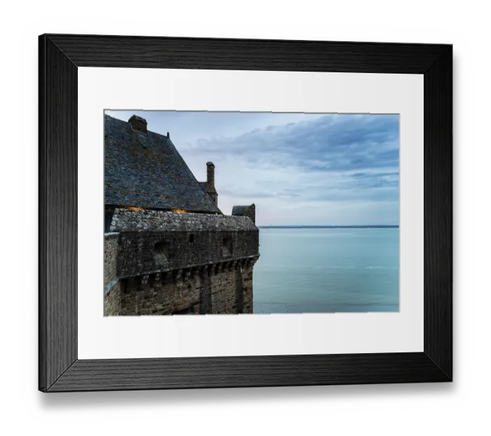 Framed Print : View of the ramparts of Mont Saint Michel with the tide coming in at sunset