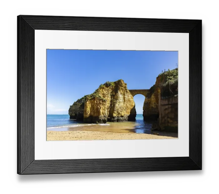 Framed Print : Yellow rocks and cliffs on a sandy beach