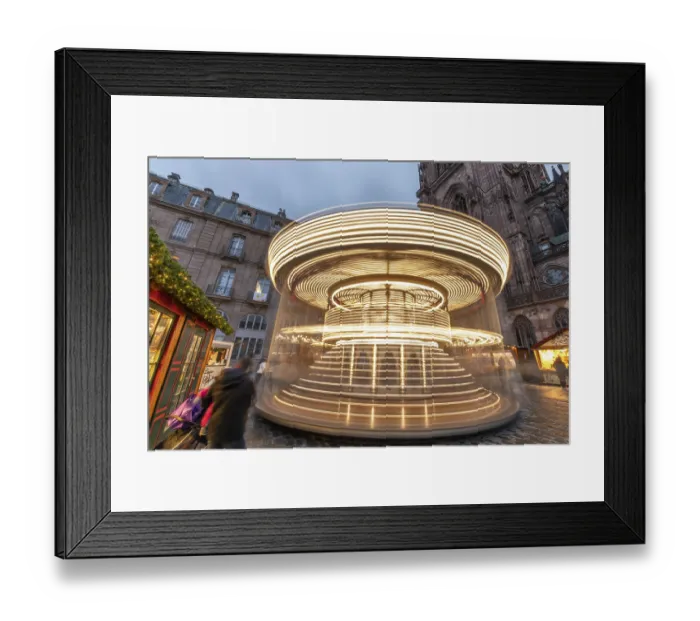 Framed Print : Vintage merry-go-round at the famous Christmas market on Strasbourg Cathedral Square in Alsace