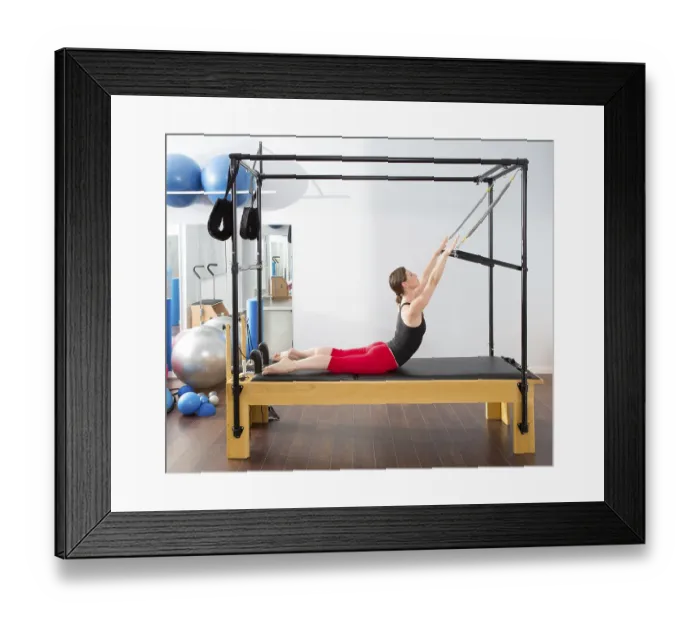 Framed Print : Pilates aerobic instructor woman in cadillac fitness exercise Framed Print : Pilates aerobic instructor woman in cadillac fitness exercise