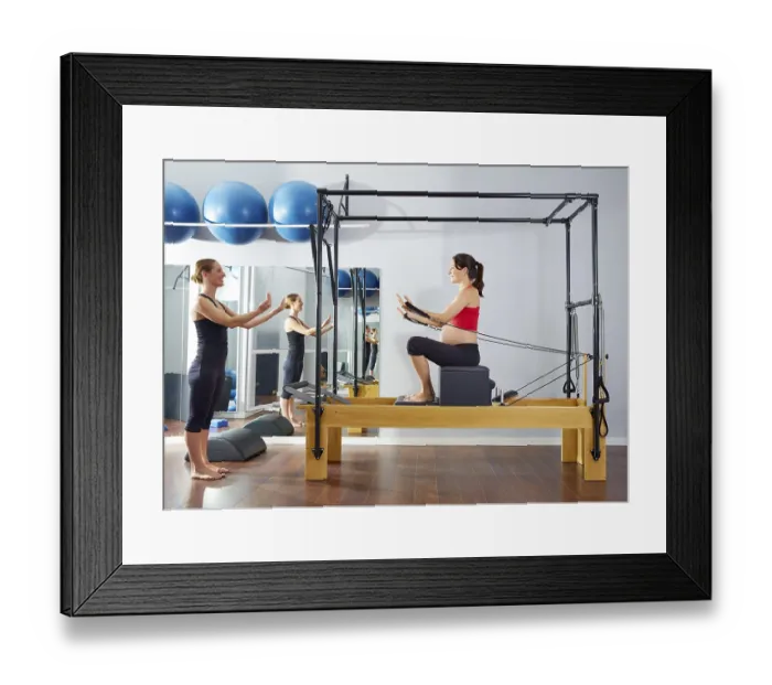 Framed Print : Pregnant woman pilates reformer short box exercise workout with personal trainer Framed Print : Pregnant woman pilates reformer short box exercise workout with personal trainer