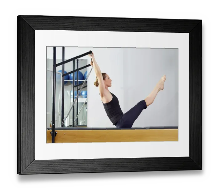 Framed Print : Pilates woman in reformer teaser exercise at gym indoor Framed Print : Pilates woman in reformer teaser exercise at gym indoor