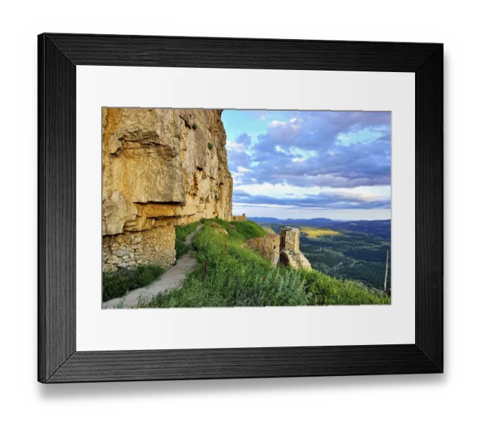 Framed Print : Landscape at sunset with large overhanging rocks and mountain views