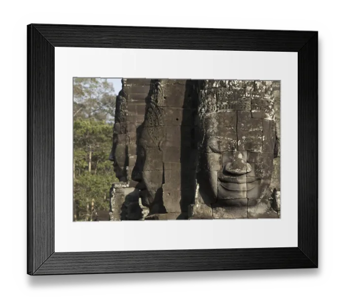 Framed Print : Large sculptures of heads on tower of Khmer temple Framed Print : Large sculptures of heads on tower of Khmer temple