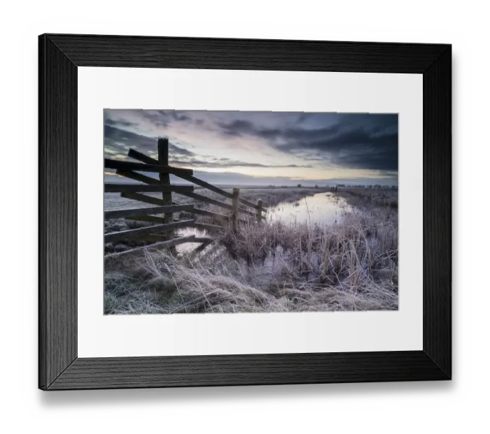 Framed Print : Cattle fence leading into ditch on frost-covered pasture at dawn