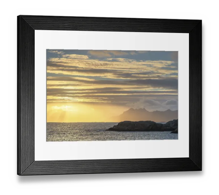 Framed Print : Sunset with golden light above the sea