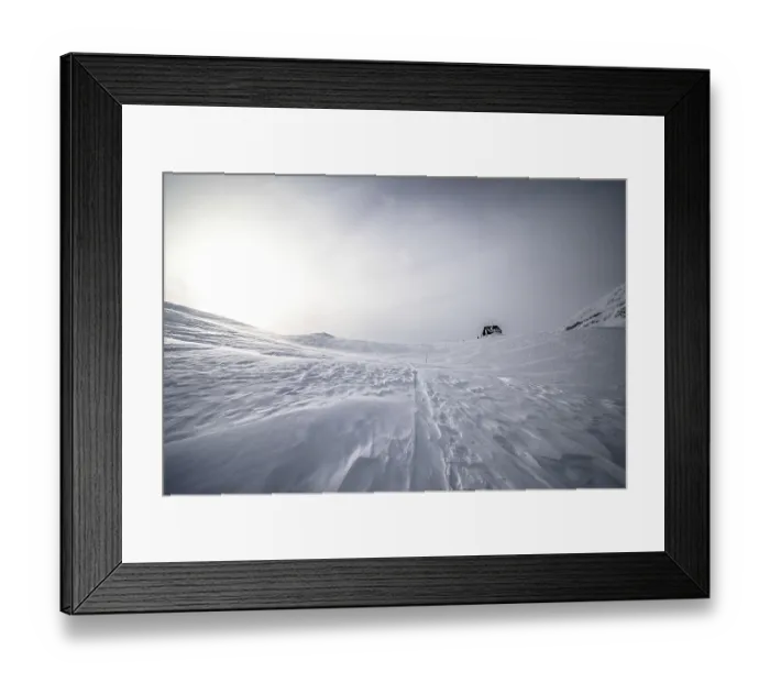 Framed Print : Snowy landscape with a lonely hut under a cloudy sky Framed Print : Snowy landscape with a lonely hut under a cloudy sky