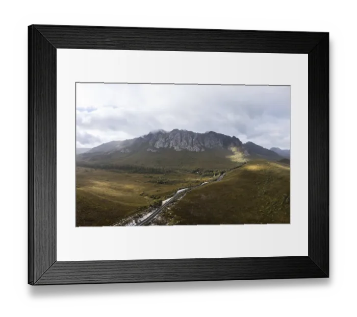 Framed Print : An aerial view of Gordon River Rd at the Sentinel range of mountains near Bitumen Bones Sculpture on a hot