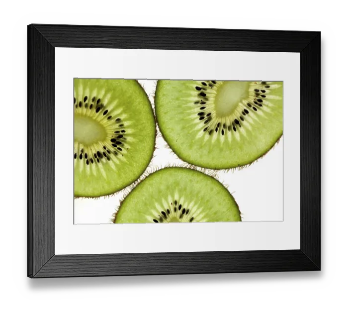 Framed Print : Cut kiwi against a white background Studio shot Framed Print : Cut kiwi against a white background Studio shot