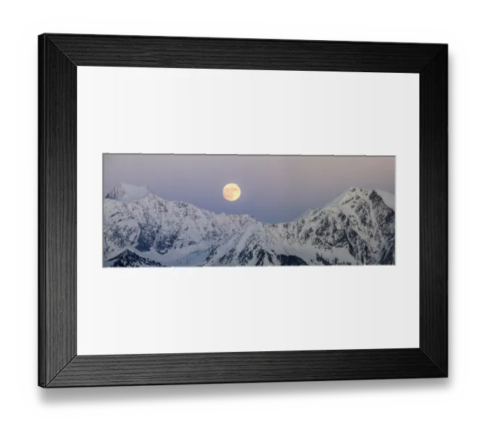 Framed Print : full moon rising into a blue sky in a winter mountain landscape in the Alps of Switzerland Framed Print : full moon rising into a blue sky in a winter mountain landscape in the Alps of Switzerland