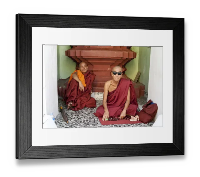 Framed Print : Buddhist monks sitting in front of a place of worship in a temple Framed Print : Buddhist monks sitting in front of a place of worship in a temple