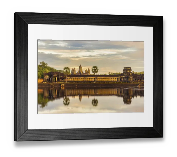 Framed Print : The ancient Khmer temple of Angkor Wat illuminated by the rays of the setting sun Framed Print : The ancient Khmer temple of Angkor Wat illuminated by the rays of the setting sun