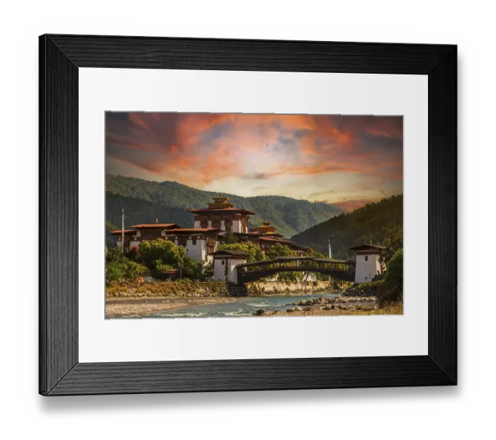 Framed Print : Punakha Dzong at sunset with the Mo Chhu river in Bhutan Framed Print : Punakha Dzong at sunset with the Mo Chhu river in Bhutan