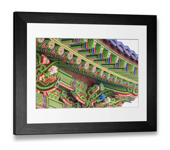 Framed Print : Eve of a Buddhist temple building with vibrant green