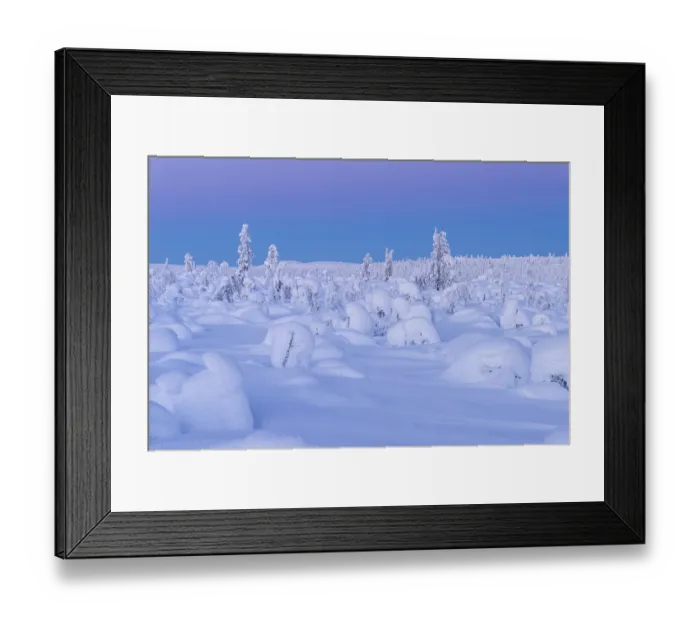 Framed Print : Snow-covered landscape at dusk