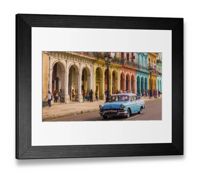 Framed Print : A blue oldtimer taxi is driving through Habana Vieja in front of a colorful facade