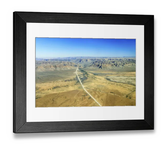 Framed Print : Sand road C26, disappearing between the mountains in the direction of Gamsberg Pass Framed Print : Sand road C26, disappearing between the mountains in the direction of Gamsberg Pass